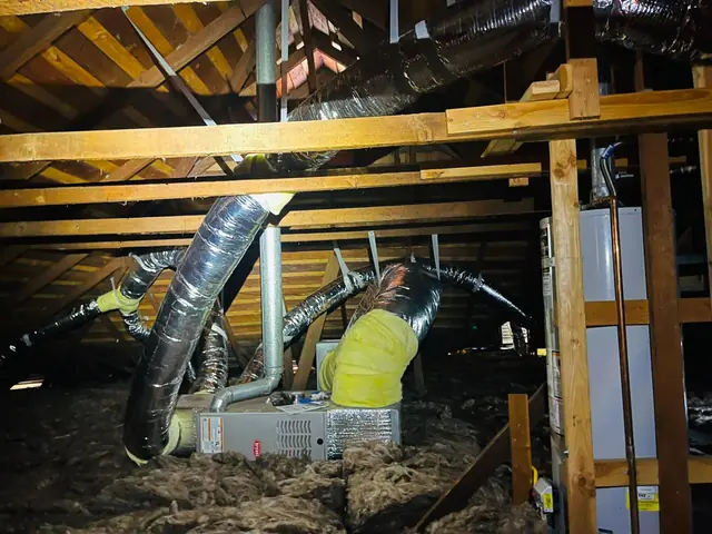 Replaced duct runs in a freshly insulated attic