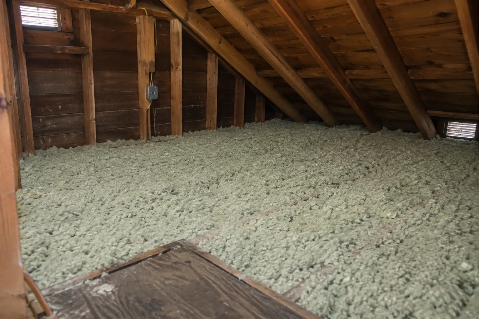 After: New blown-in insulation at an even depth.
