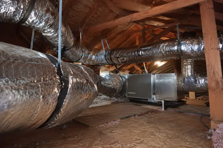 New insulated ducts connected to an attic air handler.
