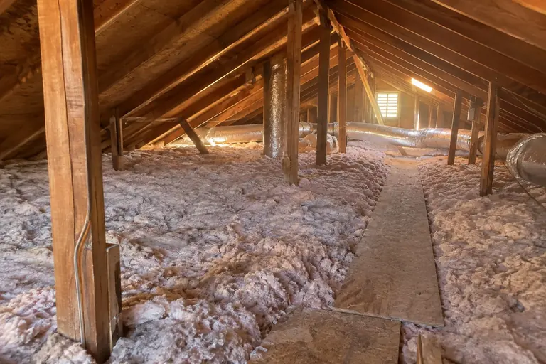 Attic finished with an even layer of new blown-in insulation.